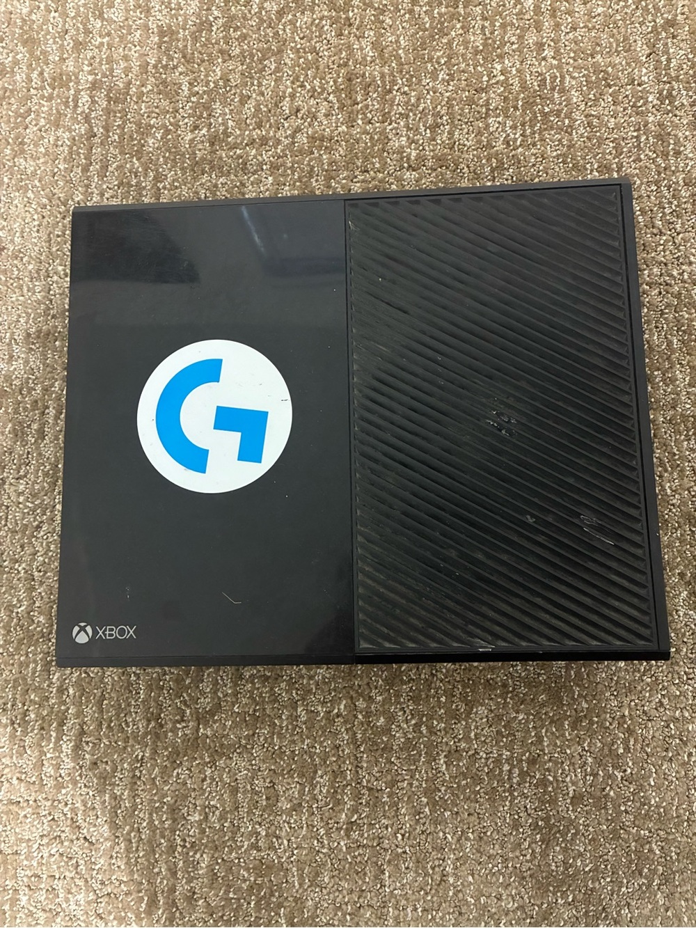 Microsoft Black Xbox Console with White and Blue Logo Sticker